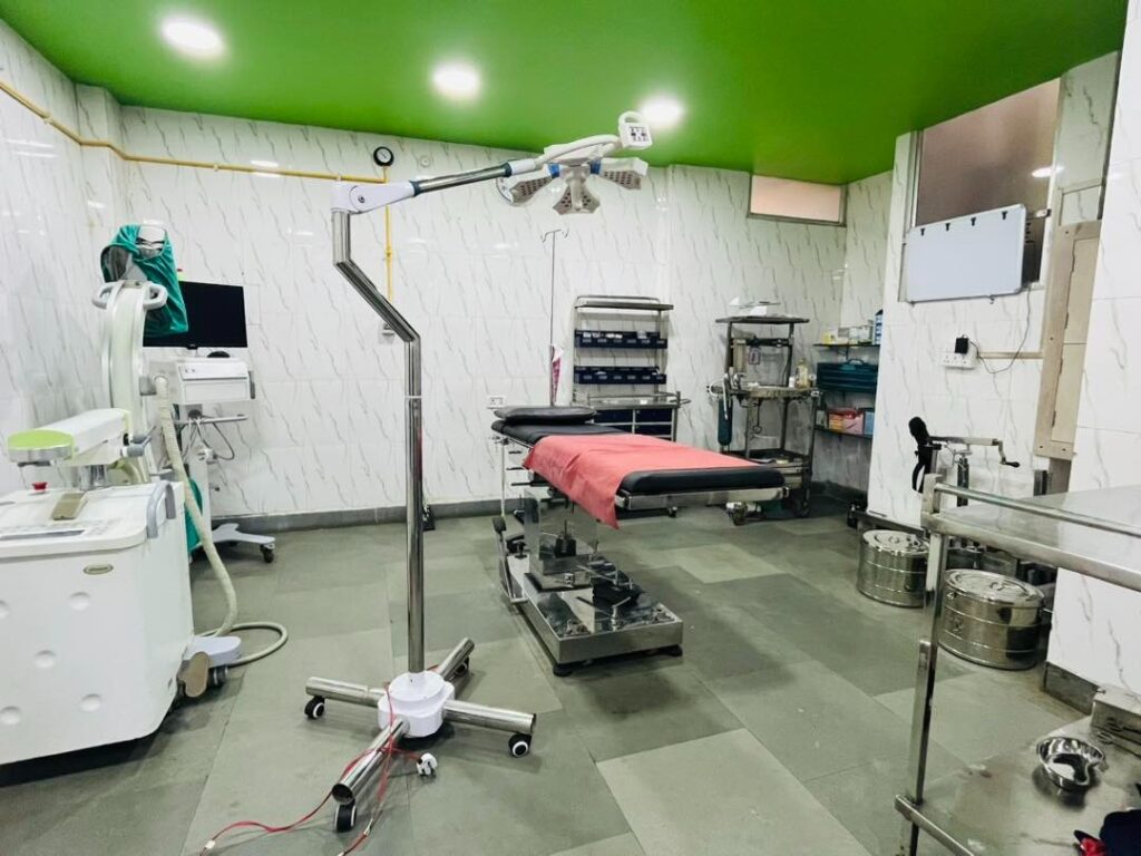 A clean and well-lit top rated healthcare facility in Jaunpur operating room with a surgical table, medical equipment, and surgical lights.