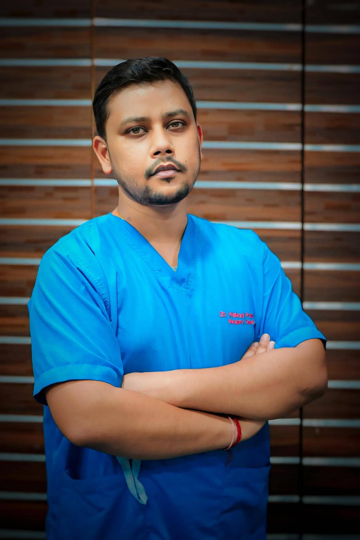 top surgeon in jaunpur Dr. Vishad Patel top surgeon in Jaunpur standing in his cabin.