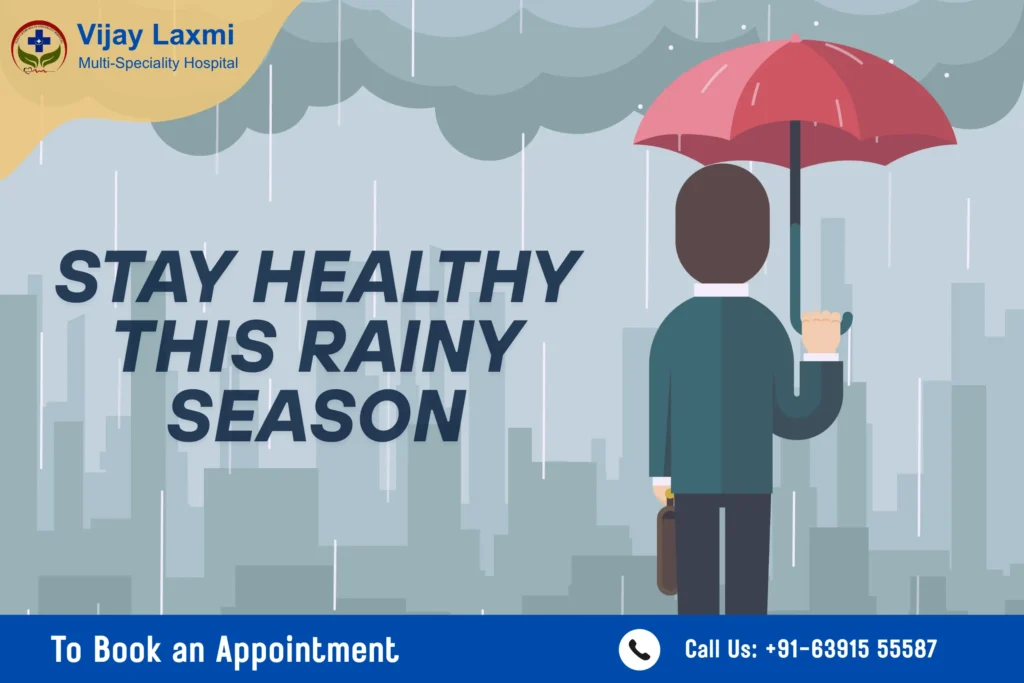 A man holding an umbrella and standing in the monsoon rain in Jaunpur